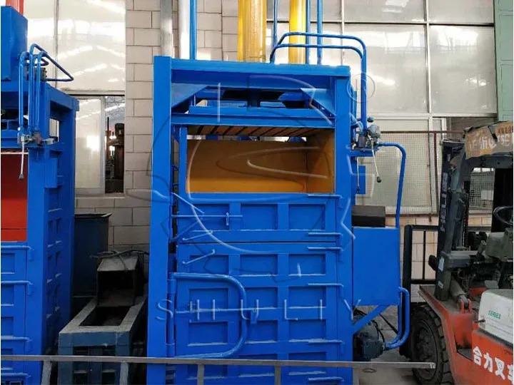 Vertical plastic baling machine