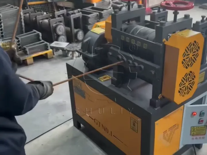 Place the bent steel bars into the rebar straightening machine